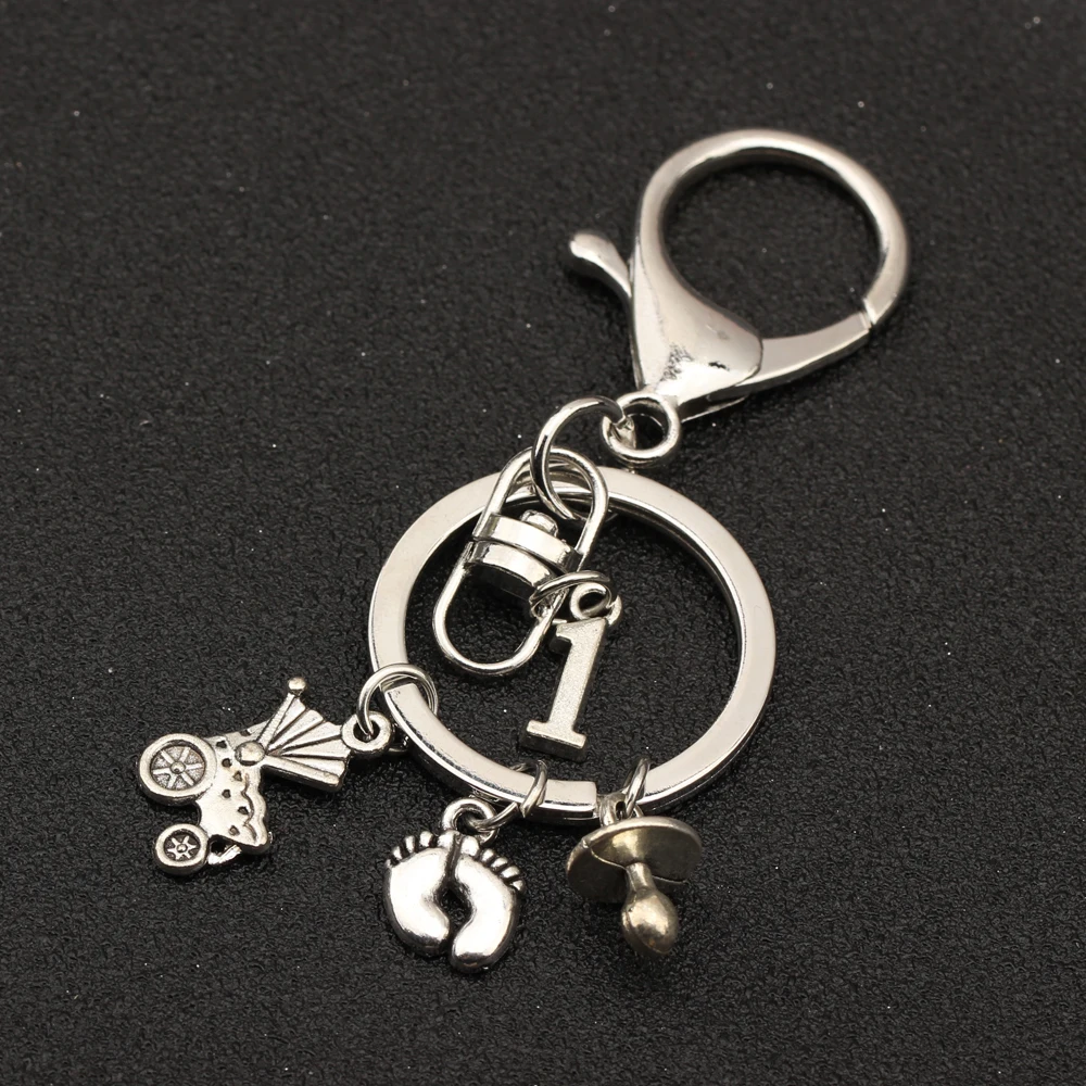 

Custom Number 0-9 Keyring Pacifiers Baby Nipple Footprint Baby First Step Baby Carriage Pendant Keychain Women Men Jewelry Gift