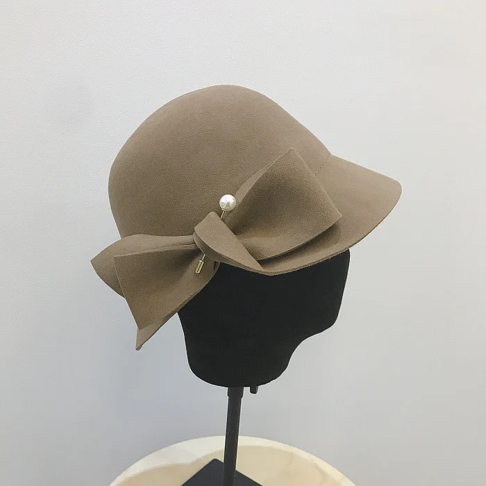 winter bucket hat 2019 Autumn And Winter New Bucket Basin Of Bowknot Pearl Wool Hat Female Warm Fashion Female Warm black fur bucket hat