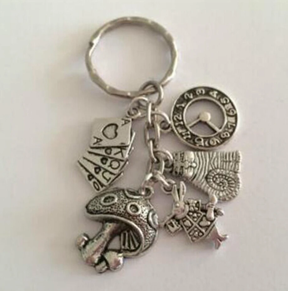 

10 pcs High Quality ALICE IN WONDERLAND themed Alloy KeyChains Gift For Women Bag Keychain Jewelry Findings