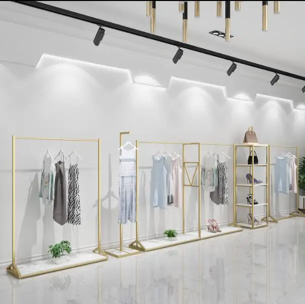 Gold clothing store display rack floor hanging rack children's clothing store shelf women's clothing store decoration design .