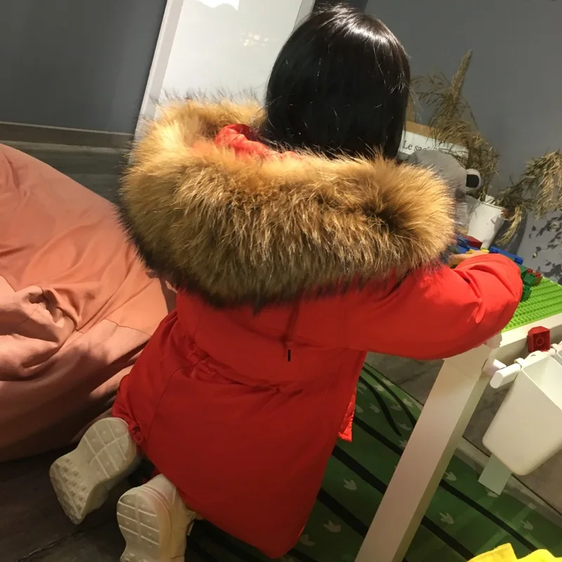 

Children Winter High Fashion Loose Big Real Raccoon Fur Hooded Thick Withe Duck Down Coats Girls Solid Long Jackets Parkas New