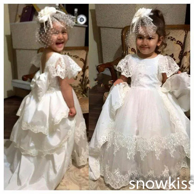 Cheap New coming white/ivory short cap sleeve lace flower girl dresses beautiful backless first communion tiered ball gowns with bow