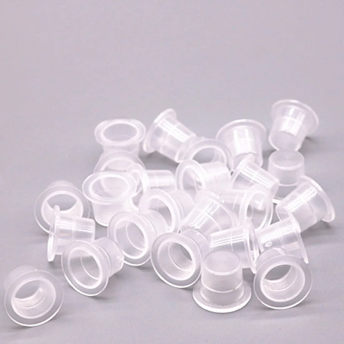 

New 100Pcs Plastic Tattoo Ink Cups For Permanent Tattoo Makeup Eyebrow Makeup Pigment Container Caps Disposable Accessories