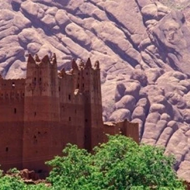 Kasbah and Unique Rock Formation  Morocco Poster Print by John & Lisa Merrill (24 x 15)