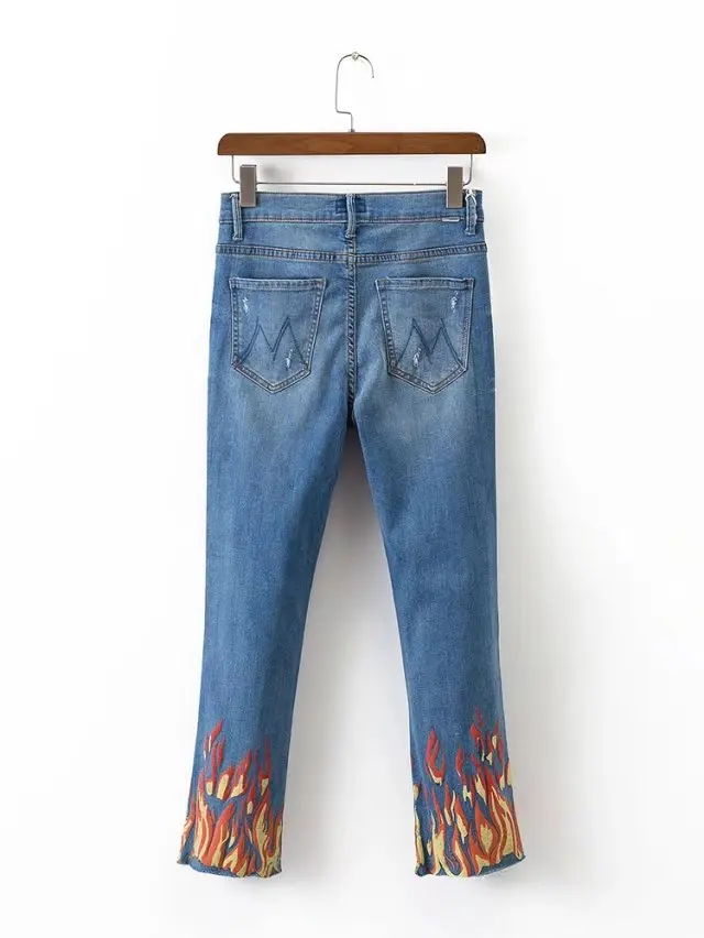 jeans with flames at the bottom