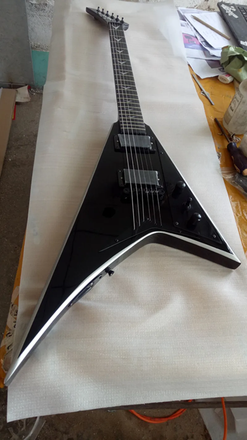 

Top quality fly V model electric guitar Black accessories The strings pass through the body Real photos free delivery