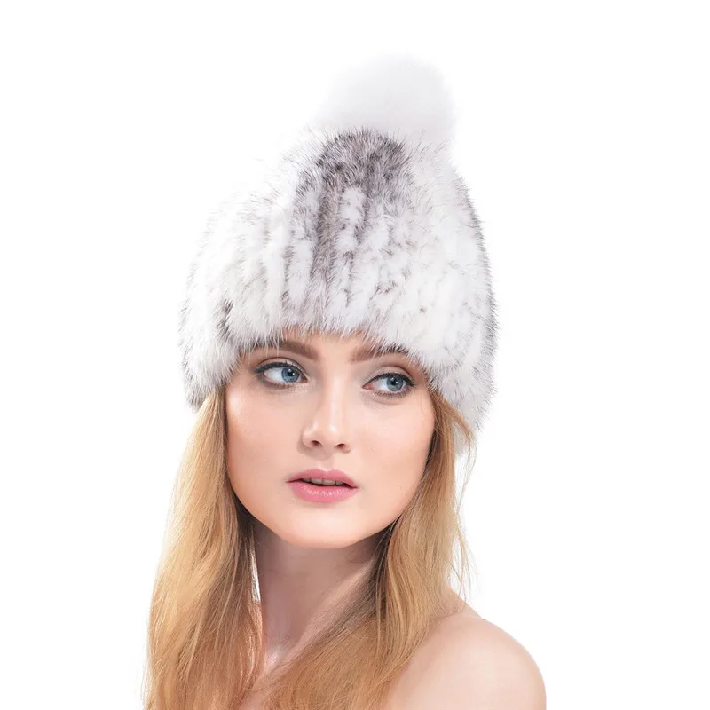 hat with fur ball on top