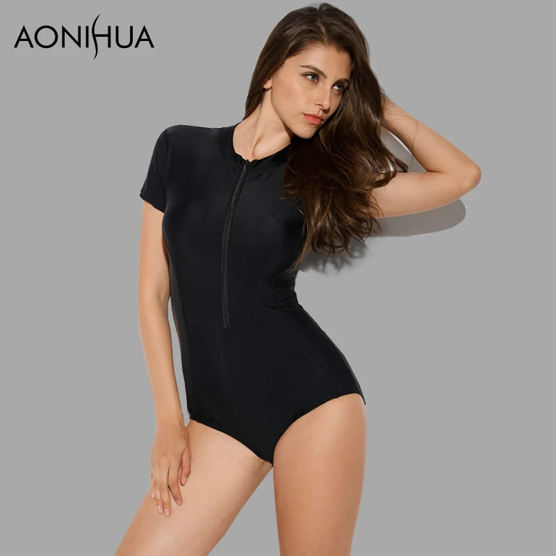 AONIHUA أسود ملابس السباحة المرأة مثير 1 قطعة واحدة ملابس السباحة 2018 قصيرة الأكمام الجبهة زيبر الصلبة الشاطئ تصفح لباس سباحة 1990 XXL
