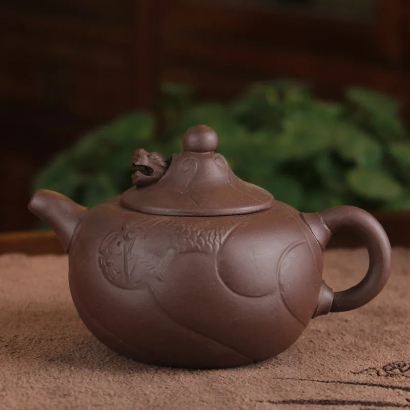 

Factory direct wholesale Yixing purple clay teapot teapot ore pieces of dragon fish 180 ml whole mixed batch