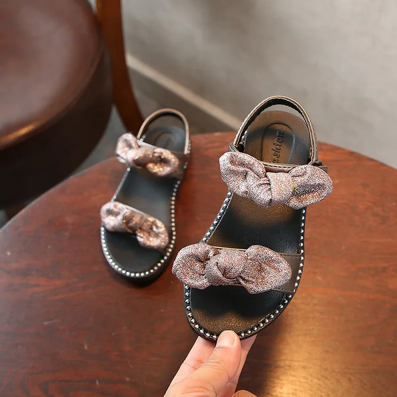 High quality Summer Fashion Girl Sandal Children Girls Flat Rome Sandal Bling Bling bowknot Kids Shoes black silver High quality Summer Fashion Girl Sandal Children Girls Flat Rome Sandal Bling Bling bowknot Kids Shoes black silver