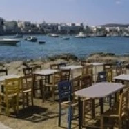 Tables and chairs in a cafe  Greece Poster Print (36 x 12)