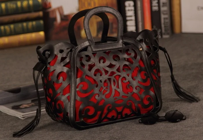 

women big hollow carved totem hand fringed bag female bag