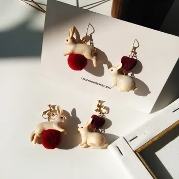 

Creative and sweet white rabbit asymmetric ear hook eardrop lovely girl style autumn and winter love hair ball ear clip