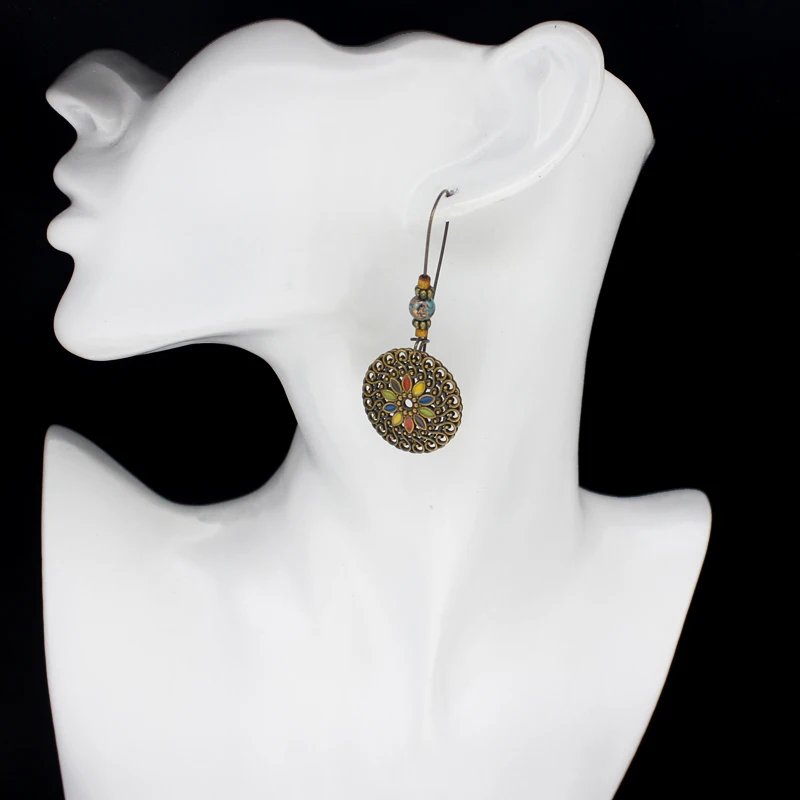 

Fashion spiral metal sunflower Earrings Five-color sunflower circular spiral metal cake shape Earrings Female fringed Earrings