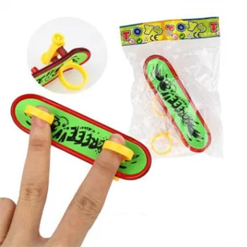 

Mini Plastic Fingerboard Professional finger skateboard for kids novelty items Toy Finger Skate with spring and ring