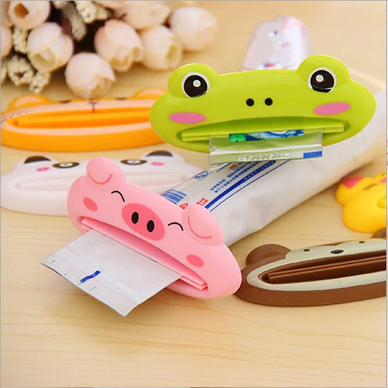 ISHOWTIENDA 1PCS 9cm x 4 cm Cute Animal Bathroom Home Tube Rolling Holder Toothpaste Squeezer Easy Cartoon Toothpaste Dispenser