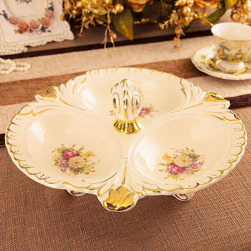 A large ceramic candy dish dry fruit European garden are divided snacks