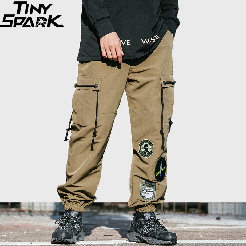 

2019 Men Cargo Pant Streetwear Hip Hip Badge Patch Harajuku Pant Side Pockets Ribbon Harem Pant Joggers Khaki Tactical Trousers