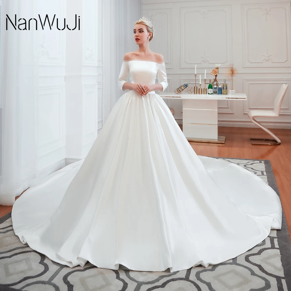 

sexy Luxury Satin Illusion Wedding Dress 2019 Vestidos de novia Boat Neck Royal Train 100cm Embroidery Gown half sleeve