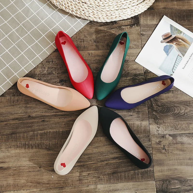 

2019 summer new simple shallow mouth candy color jelly shoes flat flat with pointed sandals.