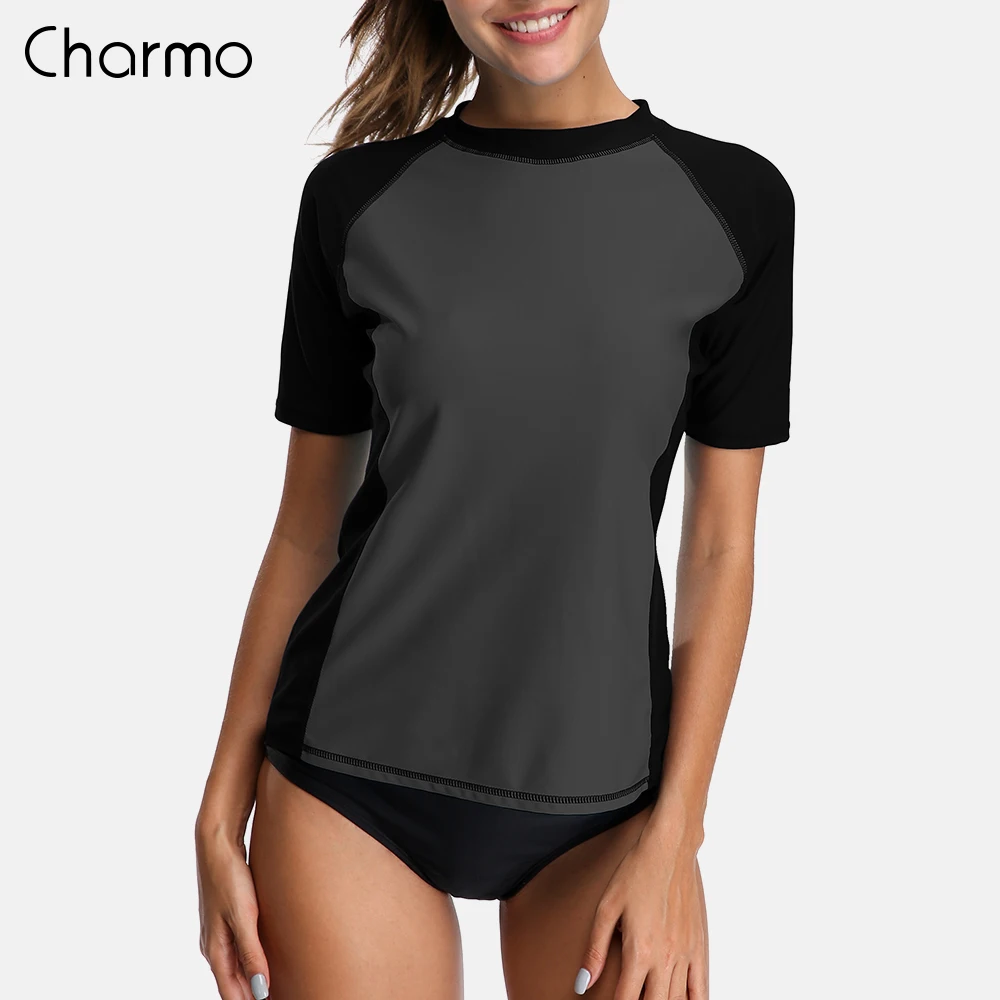 Charmo النساء قصيرة الأكمام طفح الحرس قمصان Rashguard ملابس تصفح أعلى UPF 50 + تشغيل قميص ركوب الدراجات قميص ملابس السباحة بدلة ركوب الأمواج