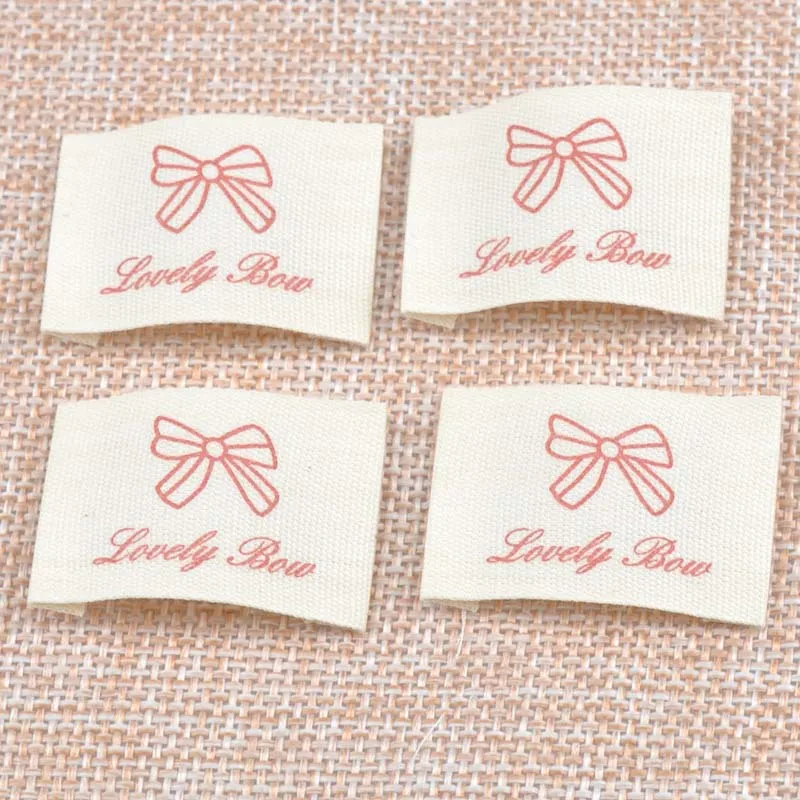 

2018 Stock clothing label tags bowknot Woven tagging labels for Clothing Shoes Bags Washable Garment Tags 25x36mm 50pcs cp1537