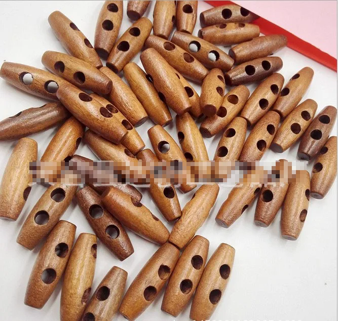 деревянные пуговицы овальные. пуговица. пуговицы деревянные длинные. пуговицы деревянные длинные. деревянные продолговатые пуговицы.