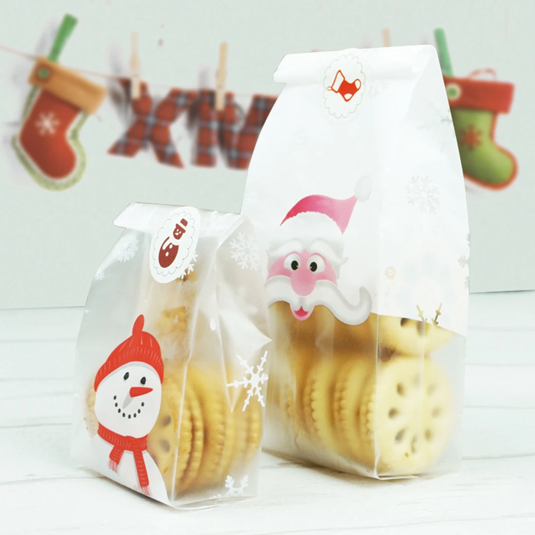 

Hot Sale 50pcs/lot 2 size Santa Claus and Christmas snowman plastic bags packaging bags pouches wrappers cupcake
