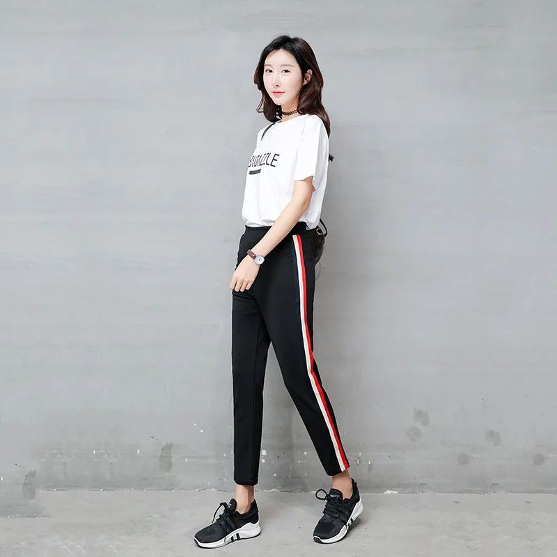 black pants with red and white stripe