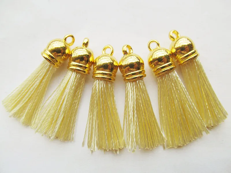 

Бесплатная доставка, 20 шт., 45 мм, Золотые пластиковые крышки для сумок, кисточки, аксессуары «сделай сам», кремовый шелковый шнур, замша, искусственная кожа