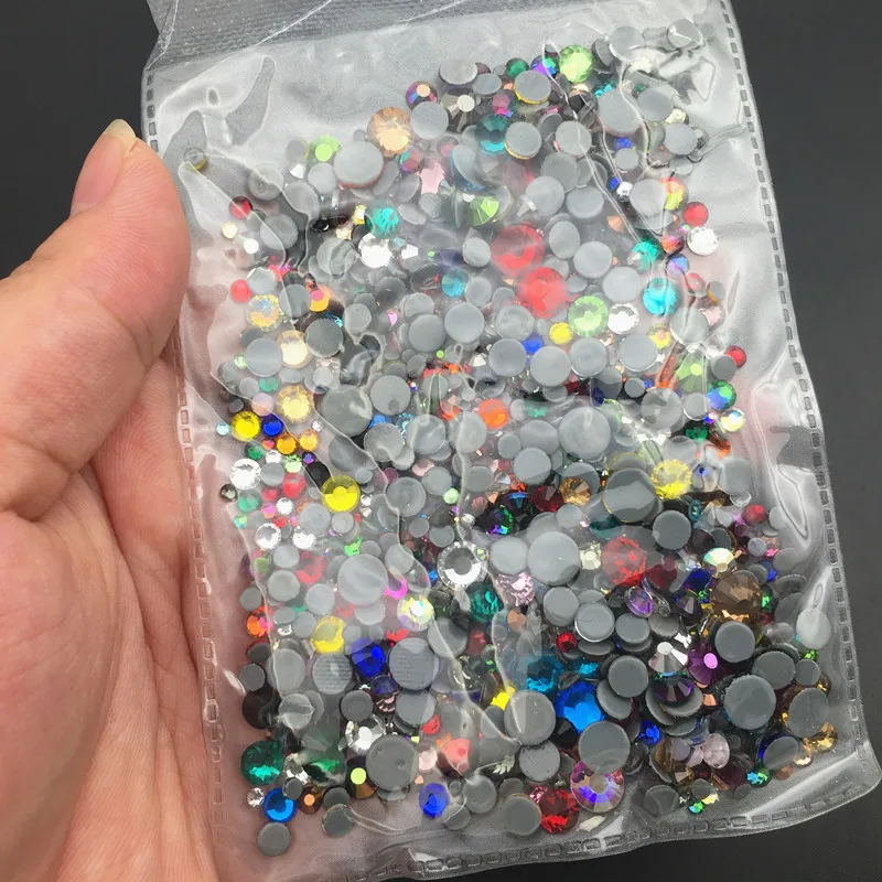 

About 1000pcs Mix Sizes Colors Hot fix Rhinestones Iron On Rhinestones For Clothes High Quality Hot back Glass Stone