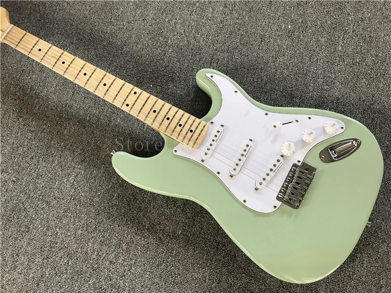 light green electric guitar with SSS pickups,maple fingerboard,white