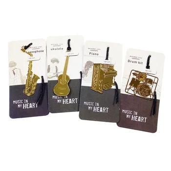 

50Pcs/lotKawaii Golden Music Bookmarks Ukulele Piano Drum Kit Saxophone Designs metal Bookmark office school Stationery supplies
