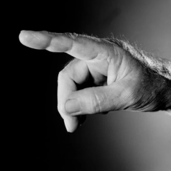 Studio shot of male hand pointing with index finger Poster Print (18 x 24)