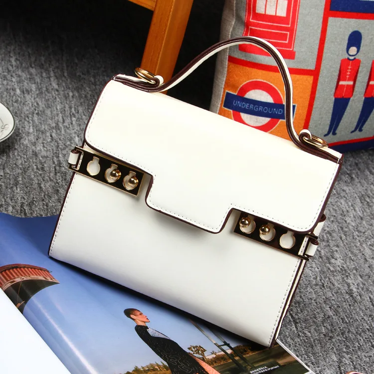 

Japan and South Korea high-quality PU leather cross-section rivets small square package with the same paragraph solid color cove