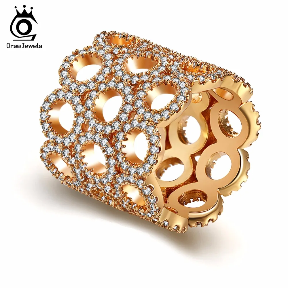 

ORSA JEWELS Women Rings AAA CZ Hollowed Design Infinity Shape Gold-color 18MM Width Female Party Jewelry New Year Gift OMR13
