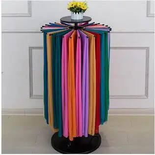 

Wrought iron spinning fabrics of silk scarf wearing clothing store white clothing display shelves floor type