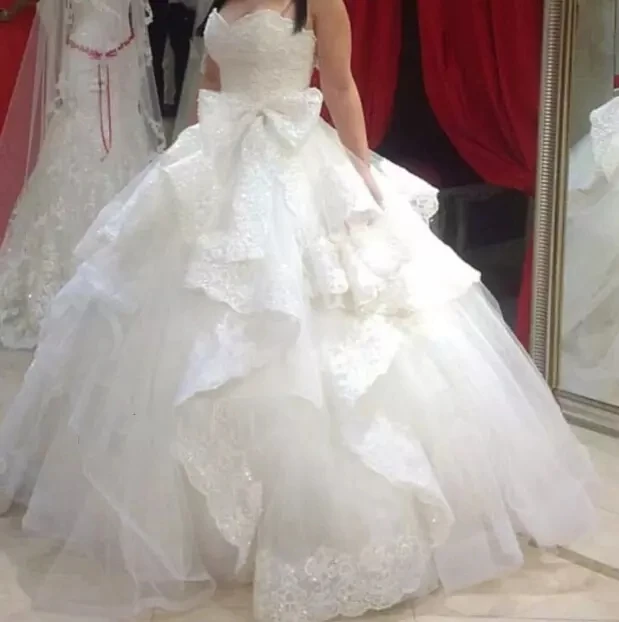 ball-gown-wedding-dresses-2016-vestidos-de-novia-sweetheart-neckline-tiered-ruffled-trimmed-lace-puffy-tulle-bridal-gowns.webp