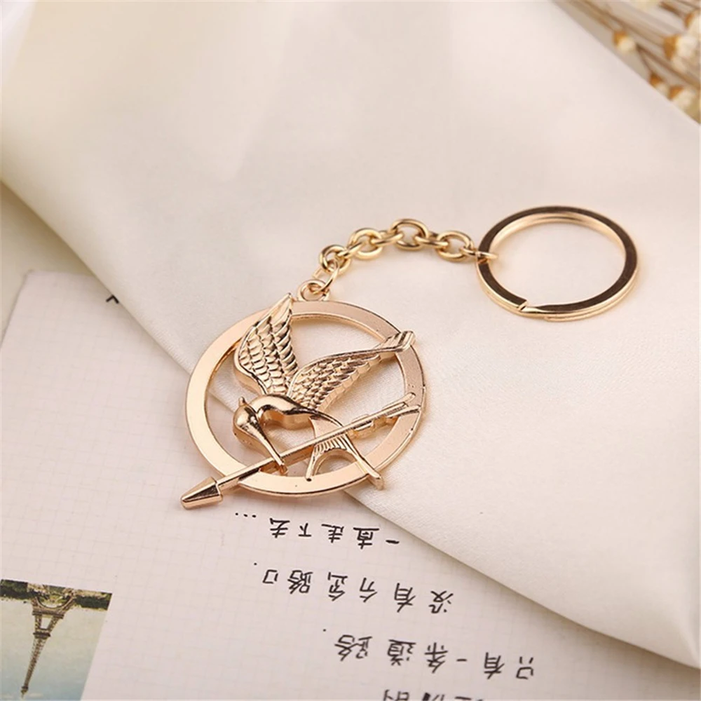 헝거 게임 키 체인 인기 빈티지 스타일 새 매력 골든 스니치 펜던트 키 체인 열쇠 고리 금속 열쇠 고리 자동차 홀더 -  AliExpress