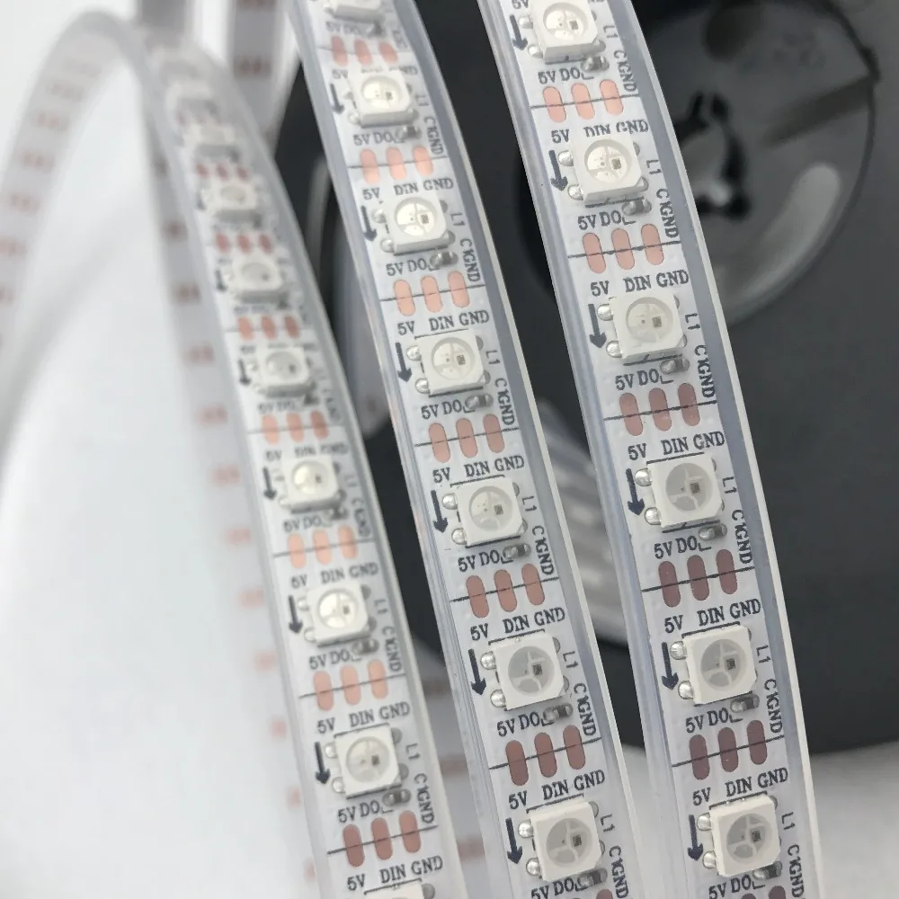 

5m DC5V WS2812B led pixel strip,waterproof in silicon tube,74pcs WS2812B/M with 74pixels;WHITE PCB,only 4PIN