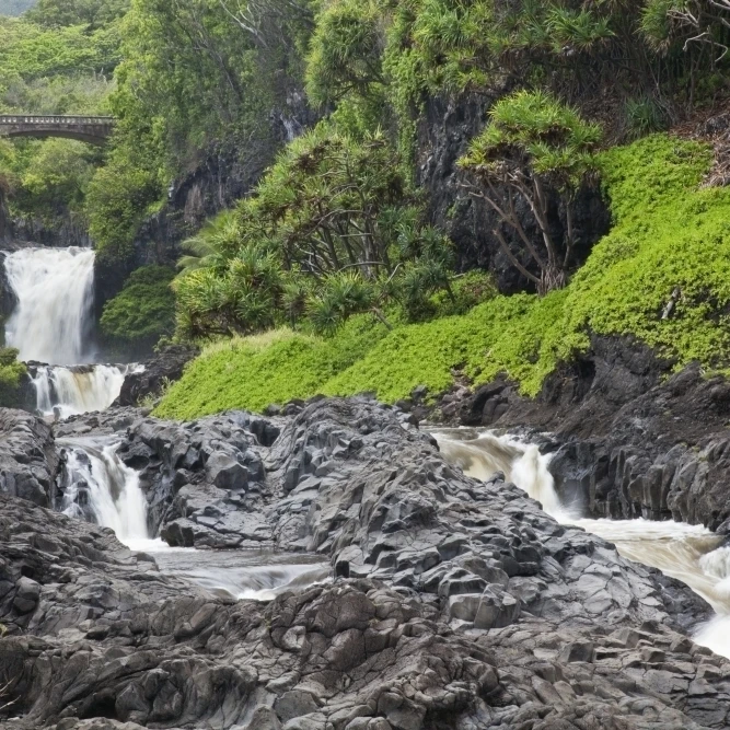Hawaii  Maui  Hana  Seven Sacred Pools  a large stream and waterfalls. Poster Print (19 x 12)