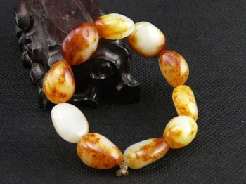 

Hetian stone seed material hand chain scattered beads raw stone with red leather seed material hand strings of men and women./1