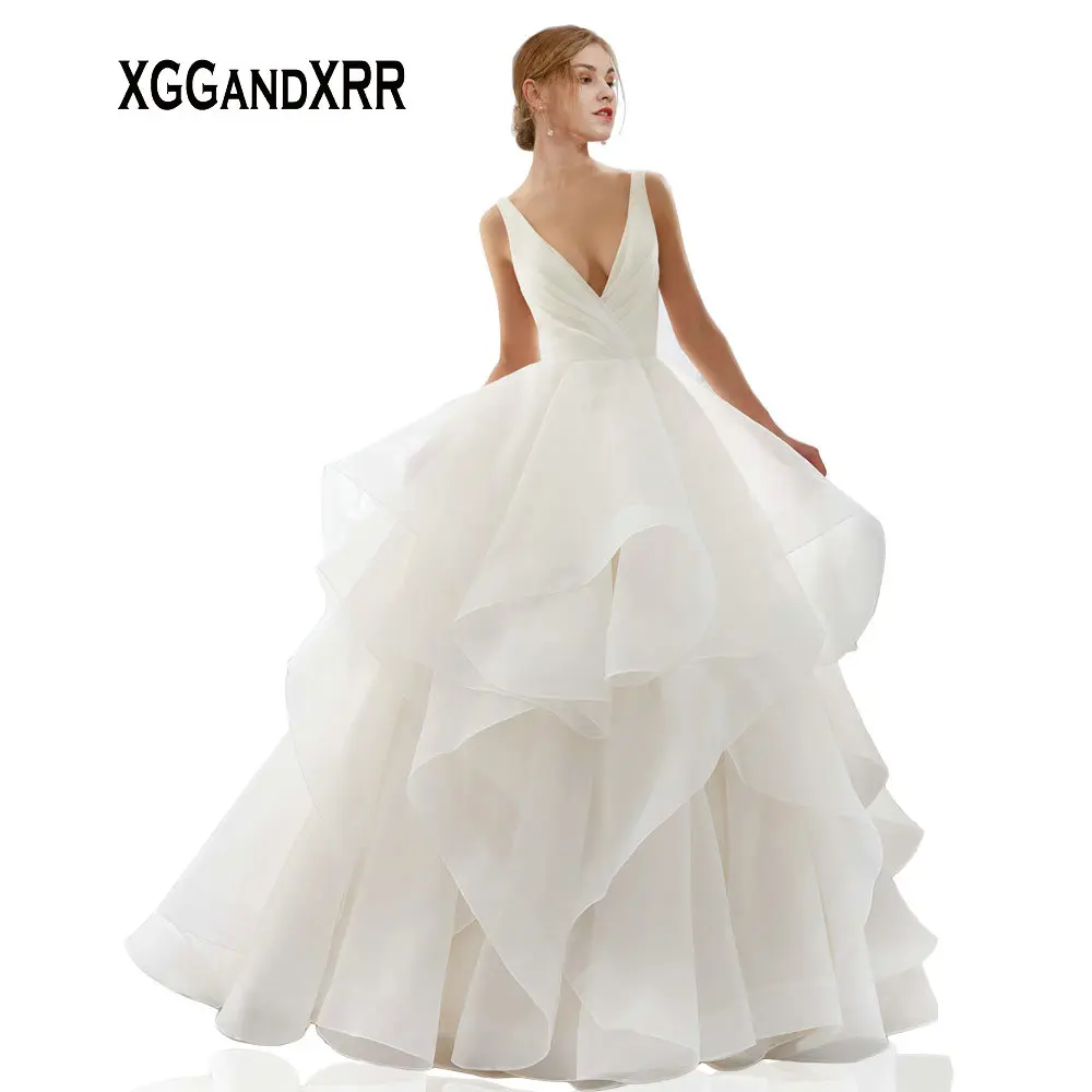 

XGGandXRR Romantic Ball Gown Organza Wedding Dress 2019 Sexy V Neck Backless Pleated Long Bridal Gown Ruffles Skirt
