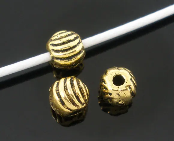 

Zinc metal alloy Spacer Beads Ball Gold Tone Stripe Pattern Color Plated About 5mm(2/8")Dia,Hole:Approx 1mm,30 PCs