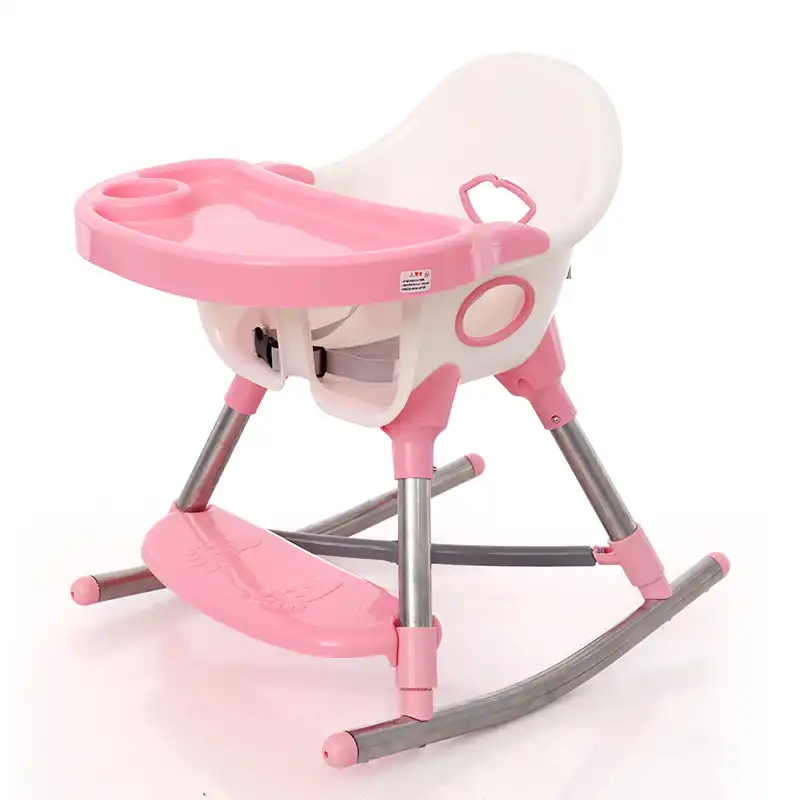 baby rocking in high chair