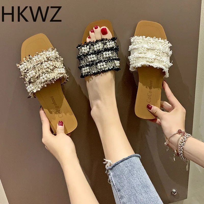 

Summer brand new open toe one word drag women wear fashion pearl cloth flat bottom slippers wild sandals Fringed pearl slippers