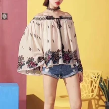 Mujeres europeas y americanas Vintage mujeres Floral manga larga acampanada Slash Neck Cffion Sexy mujeres Top camiseta