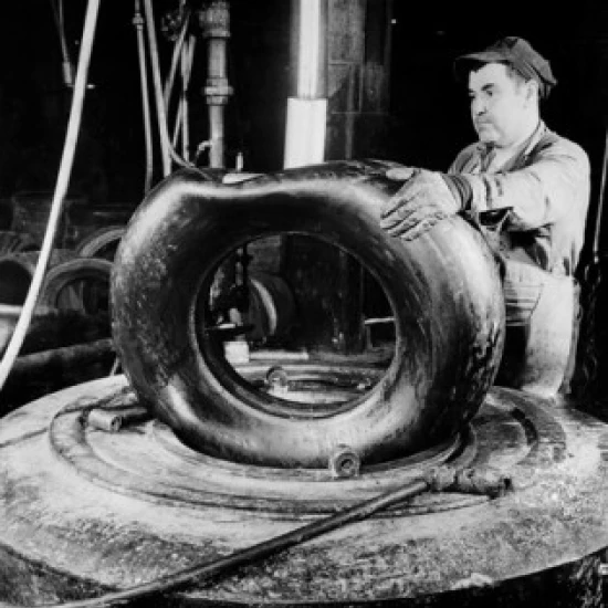 Male worker working in tire factory Poster Print (18 x 24)