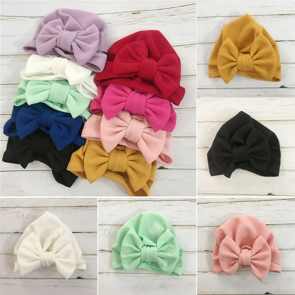 

Cute Unisex Baby Girl Turban Bow Knot Head Wrap Bunny Pure Color Hat Cap Candy Color Twist Headband Cap Baby Stretch