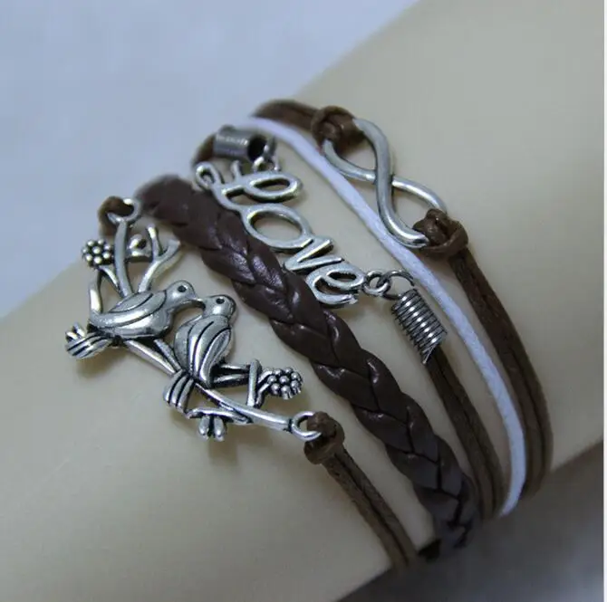 

hot sales Charming fashion jewelry leather braided rope vintage silver plated bird infinity bangle